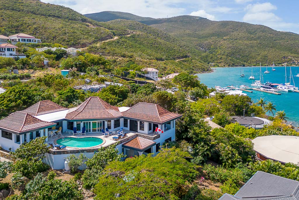 Euphoria luxury villa nestled on the lush green hillside above the crystal blue water and marina of Leverick Bay, Virgin Gorda.